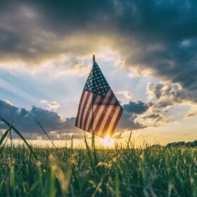 American flag at sunset in an open field for Labor Day in Colorado