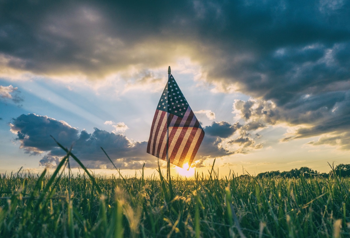 American flag at sunset in an open field for Labor Day in Colorado