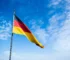 The German flag flying against a blue sky, for Oktoberfest and German-American heritage in Colorado
