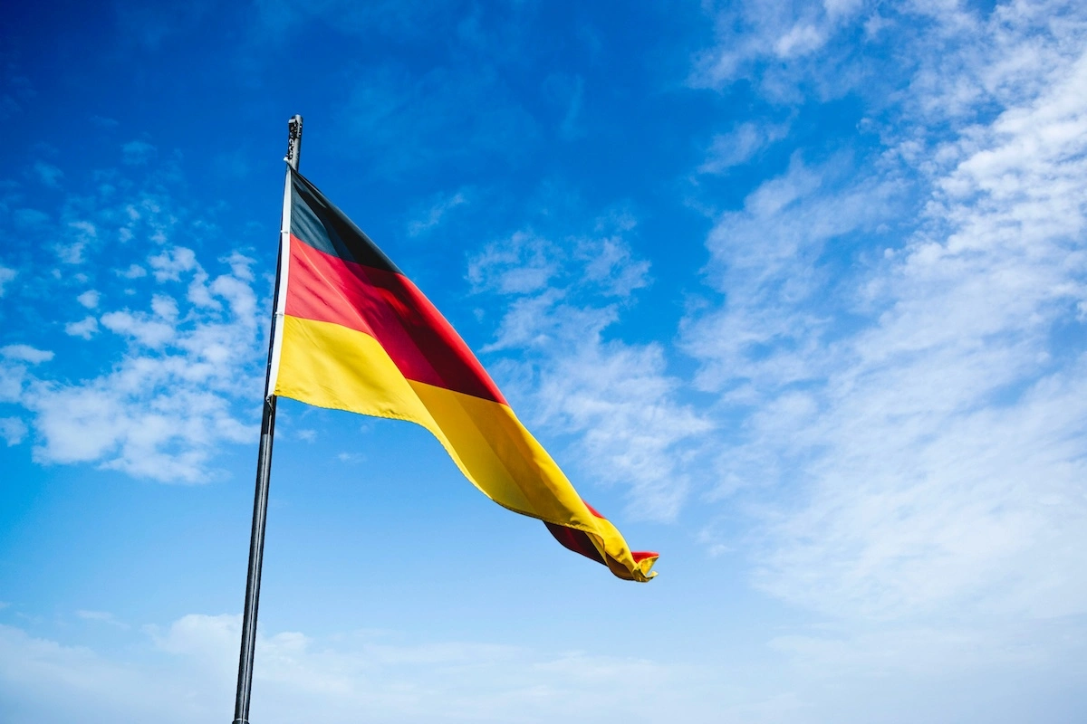 The German flag flying against a blue sky, for Oktoberfest and German-American heritage in Colorado