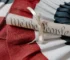 A "We the People" Constitution scroll resting on an American flag for Constitution Day